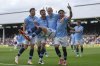 Manchester City players celebrate after Manchester City's Erling Haaland, centre, scored his side's second goal during the English Premier League soccer match between Fulham and Manchester City at Craven Cottage, London, Sunday, May 25, 2025. (AP Photo/Dave Shopland)