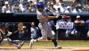 New York Mets' Mark Vientos (27) hits a sacrifice fly that that scored Juan Soto during the fourth inning of a baseball game against the New York Yankees, Saturday, May 17, 2025, in New York. (AP Photo/Noah K. Murray)