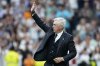 Real Madrid's head coach Carlo Ancelotti waves to the crow after a Spanish La Liga soccer match against Real Sociedad at Santiago Bernabeu stadium in Madrid, Saturday, May 24, 2025. (AP Photo/Cesar Cebolla)
