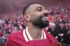 Liverpool's Mohamed Salah celebrates after winning the English Premier League soccer match between Liverpool and Tottenham Hotspur and clinching the Premier League title at Anfield in Liverpool, England, Sunday, April 27, 2025. (AP Photo/Jon Super)