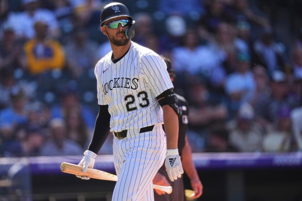 FILE - Colorado Rockies's Kris Bryant walks back to the dugout after batting in the eighth inning of a baseball game Thursday, April 10, 2025, in Denver. (AP Photo/David Zalubowski, File)