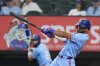 FILE - Texas Rangers' Ezequiel Duran hits a sacrifice flyout that scored teammate Jake Burger during the second inning of a baseball game against the Boston Red Sox, Sunday, March 30, 2025, in Arlington, Texas. (AP Photo/LM Otero, File)