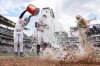 Minnesota Twins' Brooks Lee is doused with water by Ryan Jeffers after his walk off single against the Kansas City Royals during the ninth inning of baseball game, Saturday, May 24, 2025, in Minneapolis. (AP Photo/Matt Krohn)