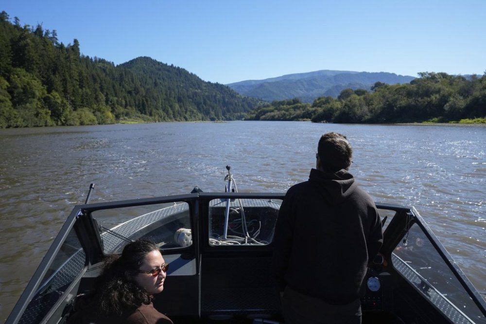 Yurok Tribe members Tiana Williams-Claussen, left, and Morgan Clayburn make their way to Blue Creek while traveling on the Klamath River, Thursday, Sept. 19, 2024, in Humboldt County, Calif. (AP Photo/Godofredo A. Vásquez)
