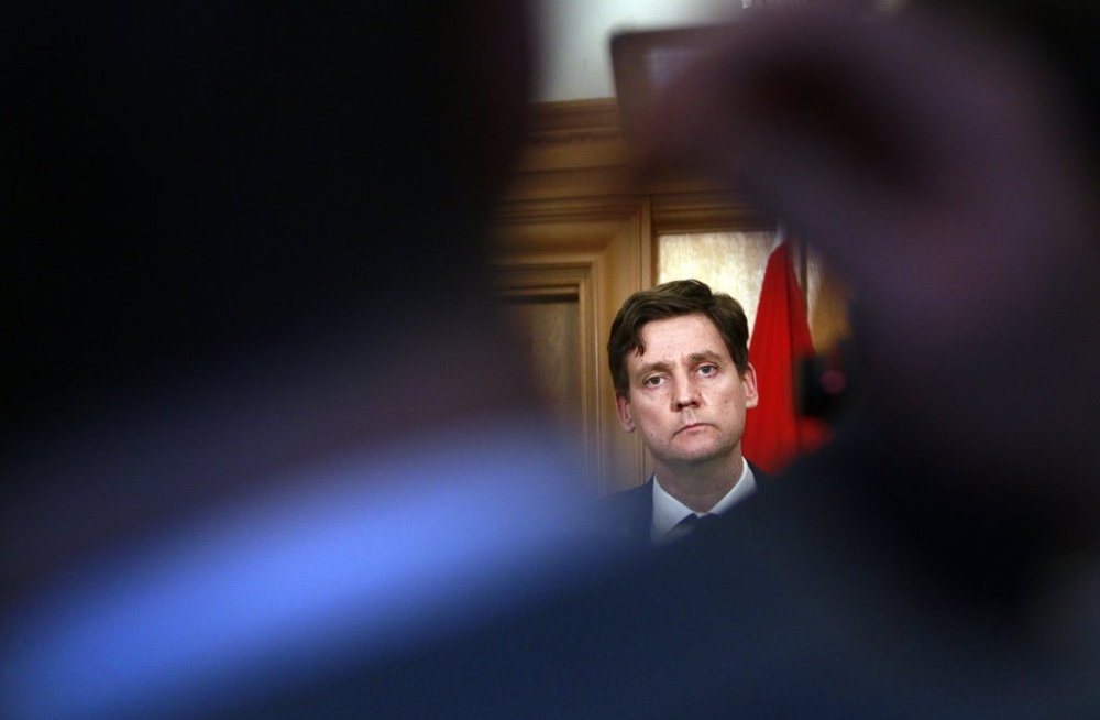 Premier David Eby speaks to reporters from his office following the throne speech at the legislature in Victoria, Feb. 18. THE CANADIAN PRESS/Chad Hipolito