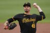 Pittsburgh Pirates pitcher Andrew Heaney delivers during the first inning of a baseball game against the Philadelphia Phillies in Pittsburgh, Saturday, June 7, 2025. (AP Photo/Gene J. Puskar)