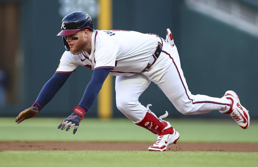 Atlanta Braves' Alex Verdugo slides into second base after a leadoff double in the first inning of a baseball game against the Washington Nationals, Monday, May 12, 2025, in Atlanta. (AP Photo/Colin Hubbard)
