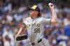 FILE - Milwaukee Brewers starting pitcher Rob Zastryzny throws against the Chicago Cubs during the first inning of a baseball game Wednesday, July 24, 2024, in Chicago. (AP Photo/Erin Hooley, File)