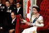 Prime Minister Pierre Trudeau looks on as Queen Elizabeth II reads the speech from the throne in the Senate chamber, officially opening the session of Parliament, in Ottawa on Oct. 18, 1977. THE CANADIAN PRESS