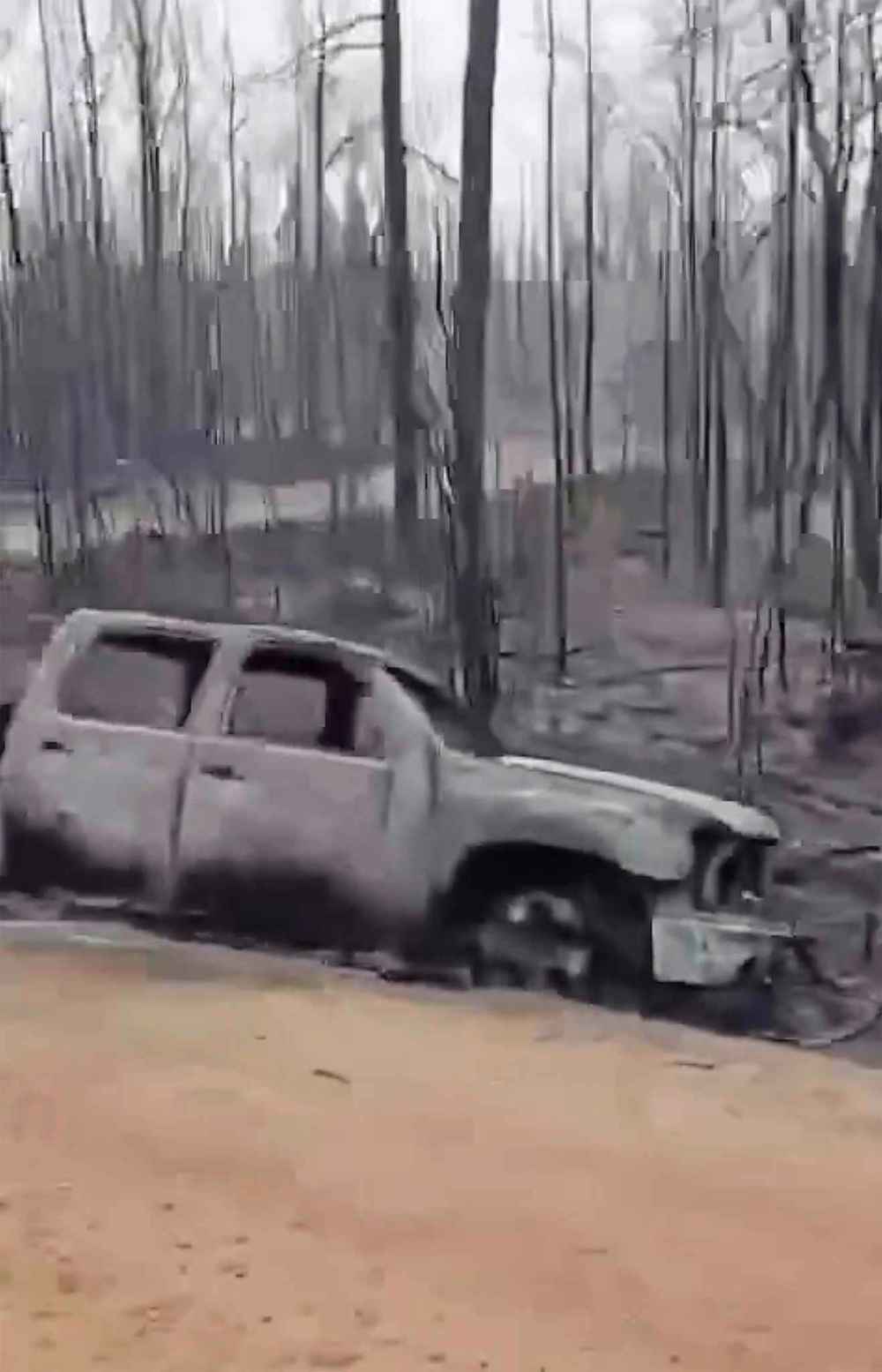Image from video shows a crew surveying damage along Wendigo Road. (Supplied)