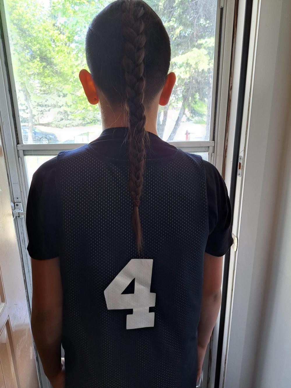 Mother Sheena Johnston said she hopes her youngest son's recent experience on a minor-league basketball court in Winnipeg serves as a learning opportunity for all referees about cultural sensitivity in sports. (Supplied)