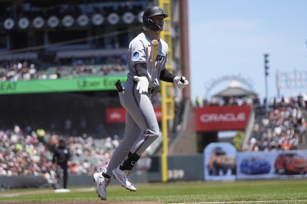 Miami Marlins' Kyle Stowers tosses his bat after hitting a three-run home run against the San Francisco Giants during the first inning of a baseball game in San Francisco, Thursday, June 26, 2025. (AP Photo/Jeff Chiu)
