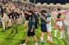 Palestinian players leave the field after an Asian Group B World Cup qualifying soccer match against Oman at the King Abdullah II Stadium in Amman, Jordan on June 12, 2025. (AP Photo/John Duerden)