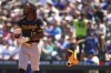 Pittsburgh Pirates' Oneil Cruz throws his arm guards after striking out to end the top of the fourth inning against the Seattle Mariners in a baseball game Sunday, July 6, 2025, in Seattle. (AP Photo/Lindsey Wasson)