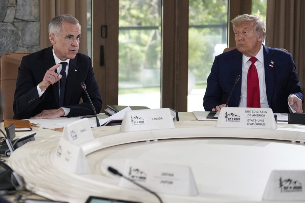 President Donald Trump, right, and Prime Minister Mark Carney participate in a session of the G7 Summit on Monday, June 16, 2025, in Kananaskis, Canada. (AP Photo/Mark Schiefelbein)