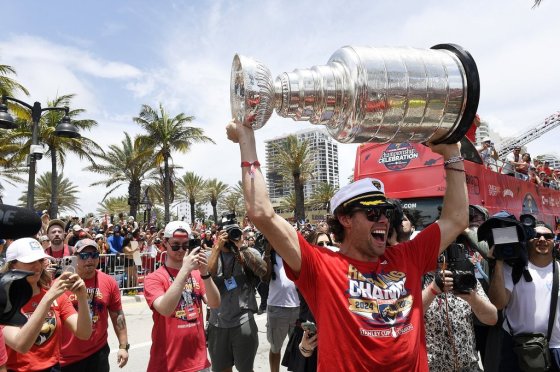 Florida Panthers' Carter Verhaeghe carries the Stanley Cup during the NHL hockey team's Stanley Cup championship celebration, Sunday, in Fort Lauderdale, Fla. (Michael Laughlin / The Associated Press files)
