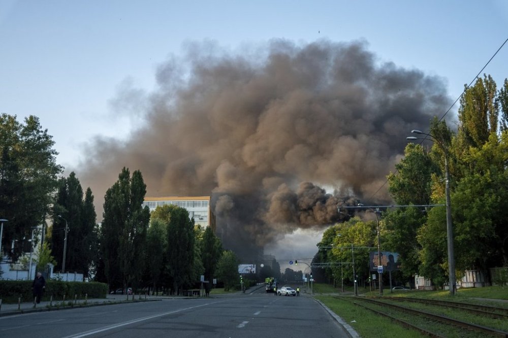 Smoke rising after Russian missile attack, which injured at least 15 people at Kyiv, Ukraine, on Tuesday, June 17, 2025. (AP Photo/Alex Babenko)