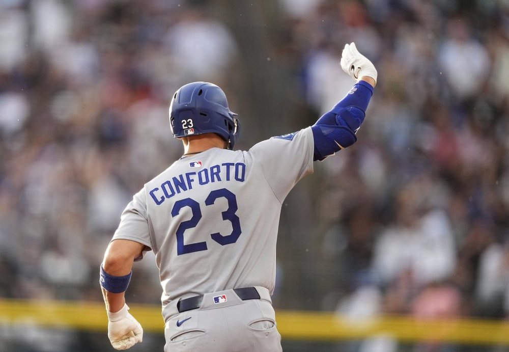 Los Angeles Dodgers' Michael Conforto gestures to the bullpen as he circles the bases after hitting a three-run home run off Colorado Rockies starting pitcher Germán Márquez in the fourth inning of a baseball game Tuesday, June 24, 2025, in Denver. (AP Photo/David Zalubowski)