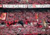 FILE - Bayer 04 Leverkusen fans cheer their team ahead the German Bundesliga soccer match between Bayer Leverkusen and FC Augsburg at the BayArena in Leverkusen, Germany, Saturday, May 18, 2024. (AP Photo/Martin Meissner, file)