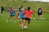 Canada captain Jessie Fleming, left to right, and Adriana Leon chase the ball as coach Casey Stoney looks on during practice, in Toronto, Thursday, June 26, 2025. THE CANADIAN PRESS/Neil Davidson