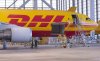 An airplane stands in the hangar during the official launching ceremony of the Airbus A330-200 cargo airplane by the European Air Transport Leipzig GmbH (EAT) at the European DHL Express air freight hub in Schkeuditz near Leipzig, Germany, Friday, Oct. 12, 2018. (AP Photo/Jens Meyer)