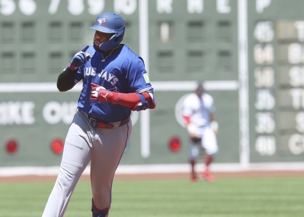 Toronto Blue Jays Vladimir Guerrero Jr. gestures after hitting a home run during the first inning of a baseball game against the Boston Red Sox, Sunday, June 29, 2025, in Boston. (AP Photo/Mark Stockwell)