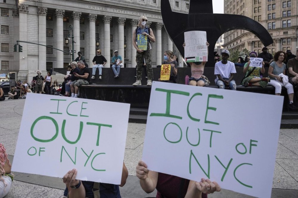 Demonstrators hold signs and chant during a protest against deportation by Immigration and Customs Enforcement in New York, Wednesday, June 11, 2025. (AP Photo/Yuki Iwamura)
