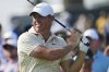 Rory McIlroy, of Northern Ireland, tees off on the 15th hole during the first round of the U.S. Open golf tournament at Oakmont Country Club Thursday, June 12, 2025, in Oakmont, Pa. (AP Photo/Gene J. Puskar)