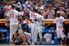 Minnesota Twins' Kody Clemens (18), back, left, celebrates with teammates after hitting a 3-run home run during the sixth inning of a baseball game against the Tampa Bay Rays Saturday, July 5, 2025, in Minneapolis. (AP Photo/Abbie Parr)
