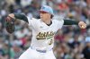 Athletics pitcher JP Sears throw to the San Francisco Giants during the second inning of a baseball game Friday, July 4, 2025, in West Sacramento, Calif. (AP Photo/Sara Nevis)