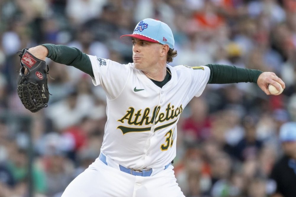 Athletics pitcher JP Sears throw to the San Francisco Giants during the second inning of a baseball game Friday, July 4, 2025, in West Sacramento, Calif. (AP Photo/Sara Nevis)