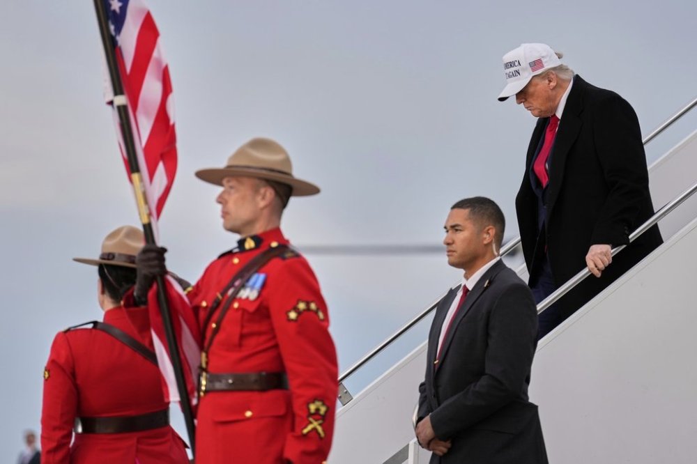 President Donald Trump arrives on Air Force 1 at Calgary International Airport, Sunday, June 15, 2025, in Calgary, Canada, ahead of the G7 Summit. (AP Photo/Mark Schiefelbein)
