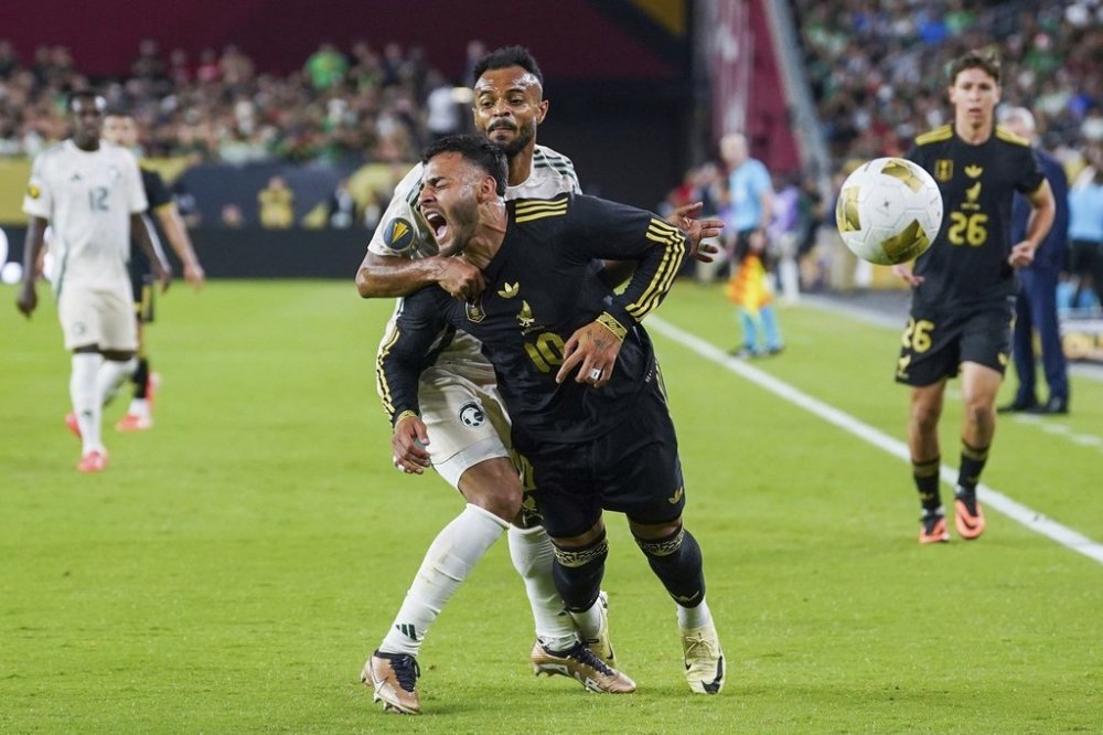 Saudi Arabia defender Ali Majrashi (26) fouls Mexico forward Alexis Vega (10) during a CONCACAF Gold Cup quarterfinal soccer match, Saturday, June 28, 2025, in Glendale, Ariz. (AP Photo/Samantha Chow)