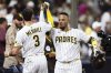 San Diego Padres' Martin Maldonado, right, celebrates with Jackson Merrill (3) after hitting a solo home run against the Los Angeles Dodgers in the sixth inning of a baseball game, Tuesday, June 10, 2025, in San Diego. (AP Photo/Derrick Tuskan)