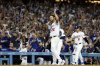 Los Angeles Dodgers pitcher Clayton Kershaw (22) tips his cap to the crowd after recording his 3,000th career strikeout against Chicago White Sox's Vinny Capra during the sixth inning of a baseball game Wednesday, July 2, 2025, in Los Angeles. (AP Photo/Kevork Djansezian)