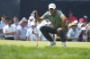 Brooks Koepka lines up a putt on the ninth hole during the first round of the U.S. Open golf tournament at Oakmont Country Club Thursday, June 12, 2025, in Oakmont, Pa. (AP Photo/Gene J. Puskar)