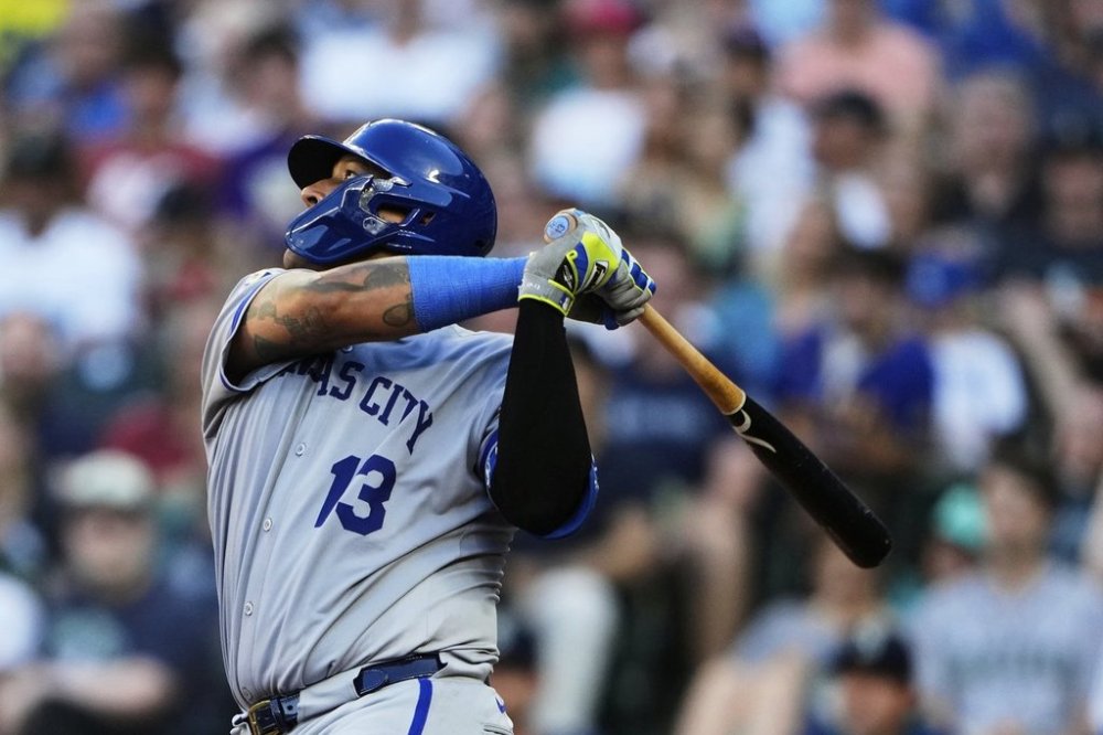 Kansas City Royals' Salvador Perez follows through on a two-run double to score Bobby Witt Jr. and Vinnie Pasquantino against the Seattle Mariners during the fifth inning of a baseball game Tuesday, July 1, 2025, in Seattle. (AP Photo/Lindsey Wasson)