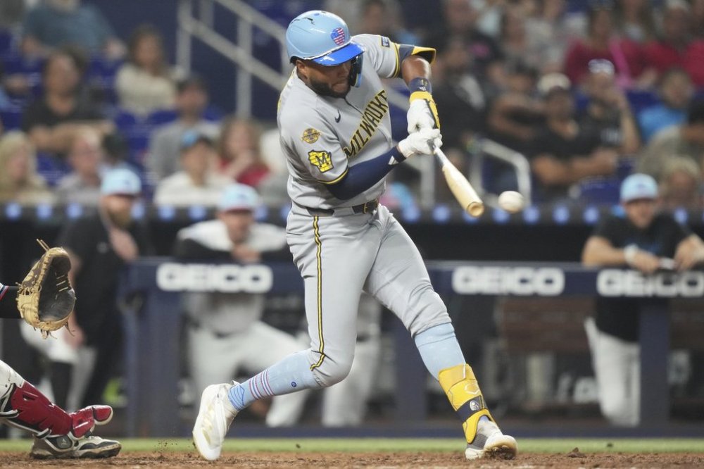 Milwaukee Brewers' Jackson Chourio hits a RBI double to score Christian Yelich during the eighth inning of a baseball game against the Miami Marlins, Friday, July 4, 2025, in Miami. (AP Photo/Lynne Sladky)