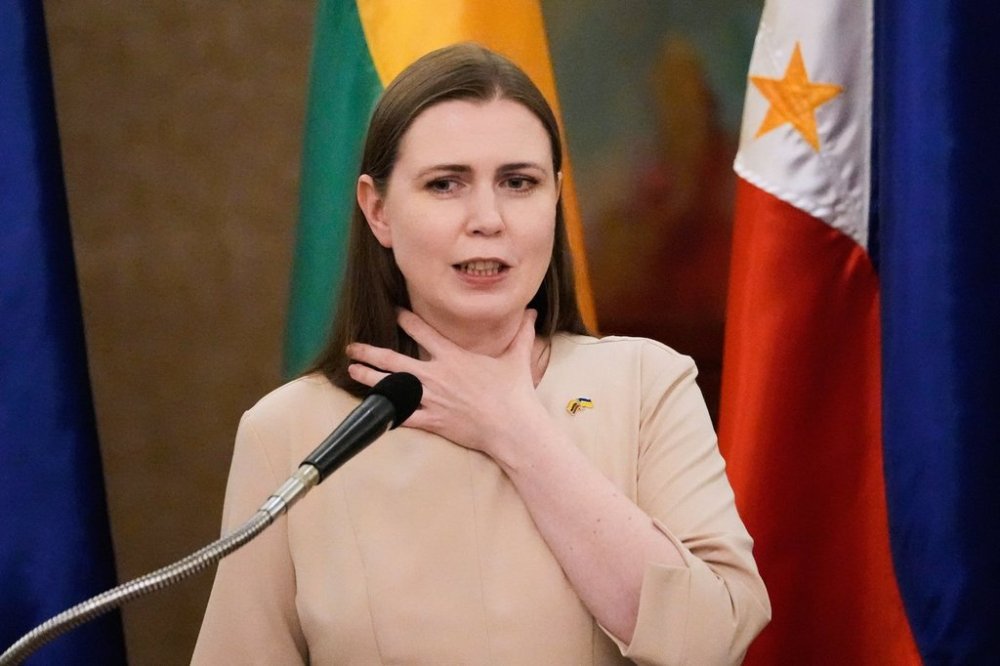 Lithuanian Minister for National Defense Dovile Sakaliene gestures during a press conference with her Philippine counterpart at a hotel in Makati, Philippines on Monday June 30, 2025. (AP Photo/Aaron Favila)