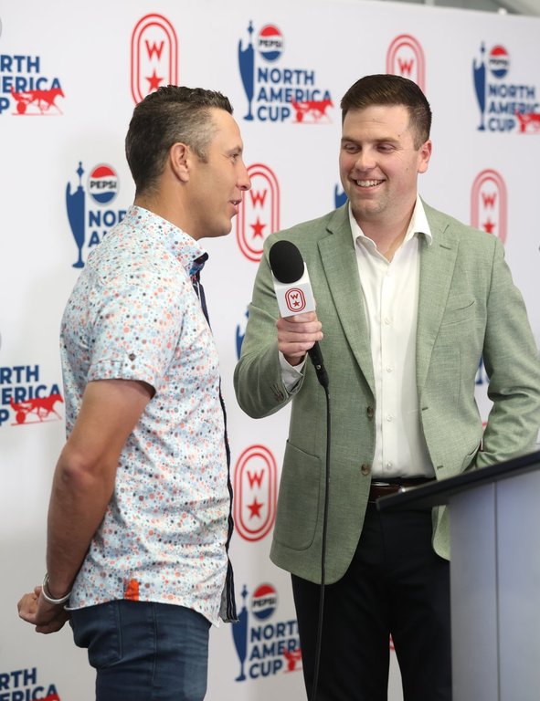 James MacDonald and host Mark McKelvie at the post position draw for the 42nd Pepsi North America Cup at Woodbine Mohawk Park in Milton, Ont. on Monday, June 9, 2025. THE CANADIAN PRESS/HO-New Image Media *MANDATORY CREDIT*