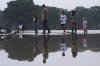 Onlookers survey damage along the Guadalupe River after a flash flood swept through the area, Friday, July 4, 2025, in Kerrville, Texas. (AP Photo/Eric Gay)