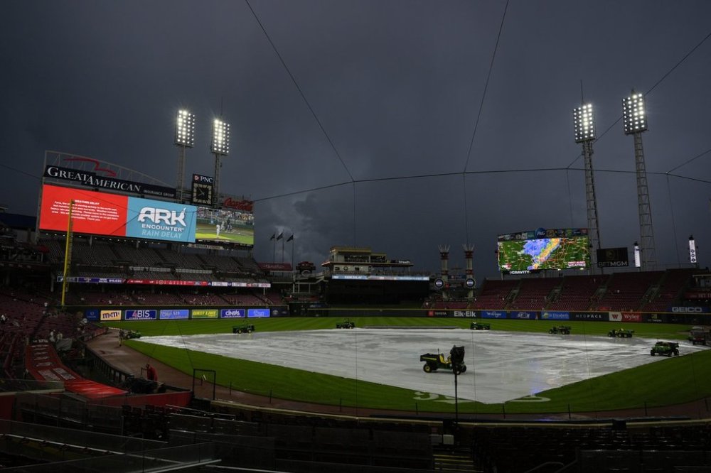Dark storm clouds over Great American Ball Park during a weather delay before a baseball game between the Cincinnati Reds and the Minnesota Twins, Wednesday, June 18, 2025, in Cincinnati. (AP Photo/Carolyn Kaster)