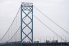 Trucks cross between the United States and Ontario, Canada across the Ambassador Bridge, Monday, Feb. 3, 2025, in Detroit. (AP Photo/Paul Sancya)