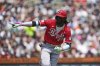 Cincinnati Reds' Elly De La Cruz points to the dugout after hitting a one-run single against the Detroit Tigers in the eighth inning during a baseball game, Sunday, June 15, 2025, in Detroit. (AP Photo/Paul Sancya)