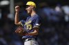 FILE - Milwaukee Brewers pitcher Jacob Misiorowski smiles during the first inning of a spring training baseball game against the Chicago Cubs, Tuesday, March 11, 2025, in Mesa, Ariz. (AP Photo/Matt York, file)