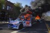 FILE - Multiple Waymo taxis burn near the Metropolitan Detention Center of downtown Los Angeles, Sunday, June 8, 2025, following last night's immigration raid protest. (AP Photo/Eric Thayer, File)