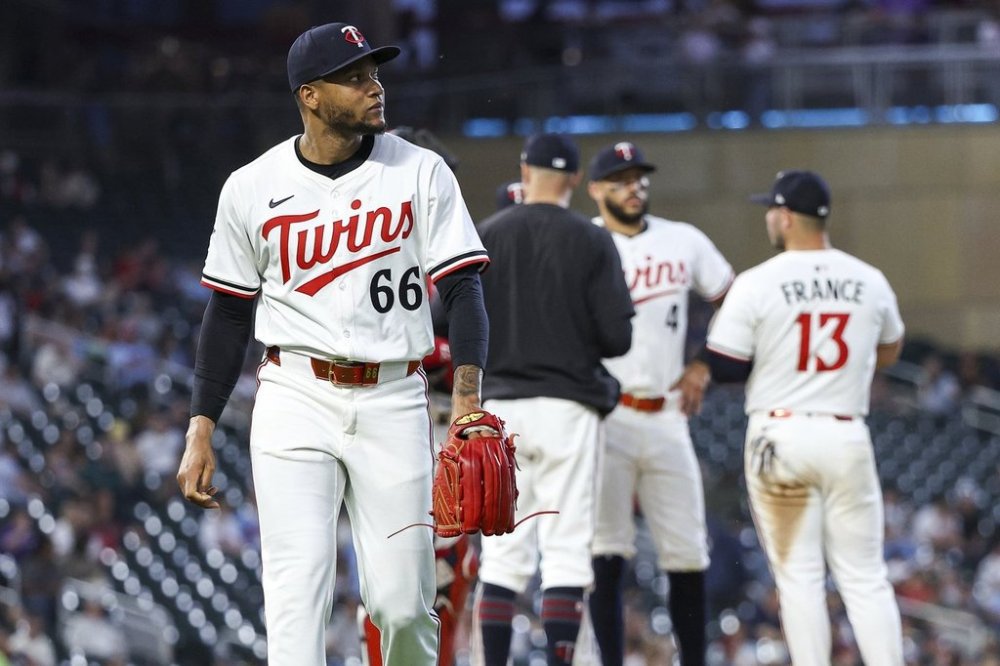 Minnesota Twins relief pitcher Jorge Alcala reacts after being taken out of the game during the eighth inning of baseball game against the Texas Rangers, Tuesday, June 10, 2025, in Minneapolis. (AP Photo/Matt Krohn)