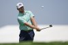 Alistair Docherty chips onto the third hole during a practice round ahead of the U.S. Open golf tournament at Oakmont Country Club Wednesday, June 11, 2025, in Oakmont, Pa. (AP Photo/Charlie Riedel)