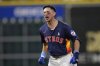Houston Astros' Mauricio Dubón celebrates after hitting a game-winning RBI single against the Minnesota Twins during the 10th inning of a baseball game Sunday, June 15, 2025, in Houston. (AP Photo/David J. Phillip)