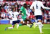 Senegal's Ismaila Sarr, center, gets free of England's Kyle Walker to score his side's first goal of the game during an international friendly match at The City Ground, in Nottingham, England, Tuesday, June 10, 2025. (Mike Egerton/PA via AP)